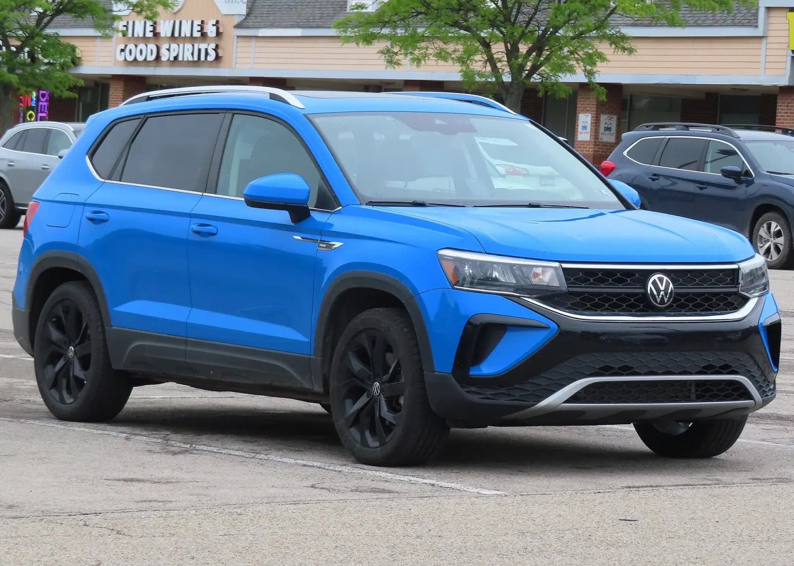 Blue Volkswagen Taos SE 4Motion, front three-quarter view