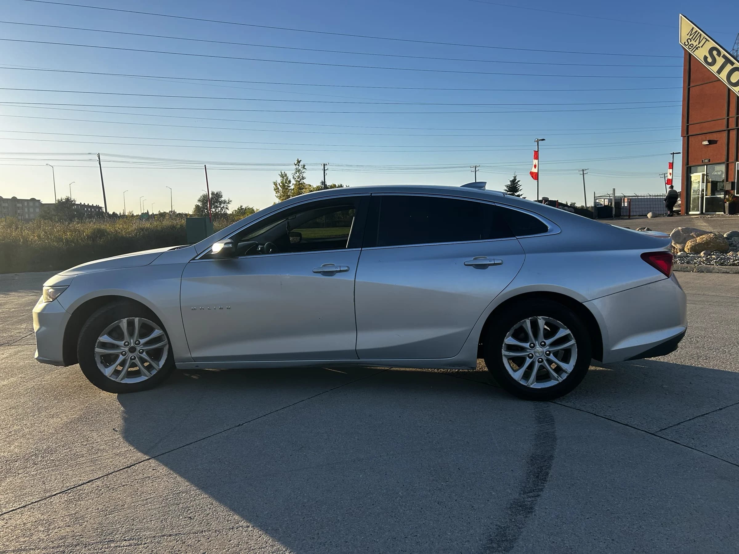 Silver 2018 Chevrolet Malibu LT sedan, driver-side profile