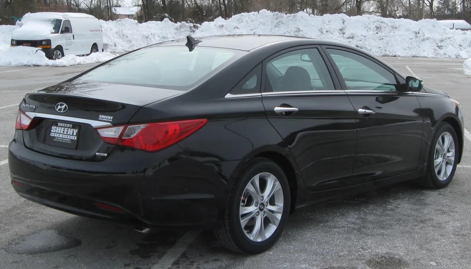 Black 2011 Hyundai Sonata Limited sedan, rear three-quarter view