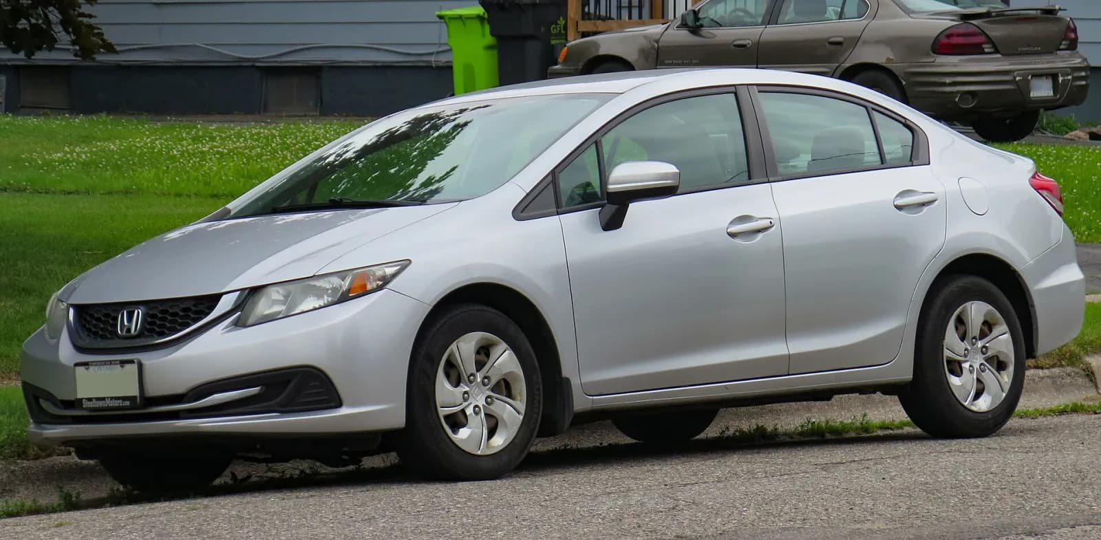 Silver 2015 Honda Civic LX sedan, front three-quarter view