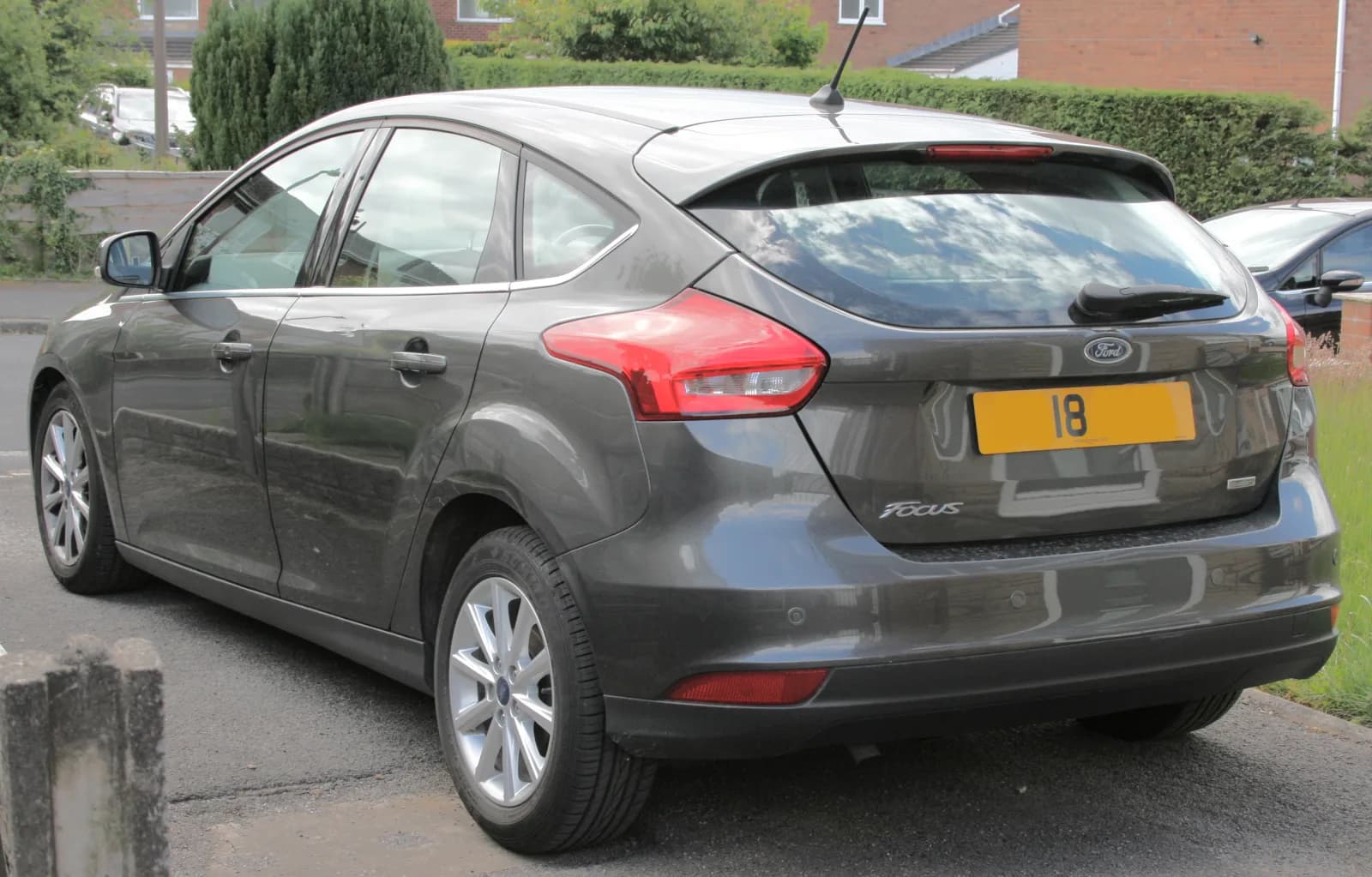Grey Ford Focus hatchback, rear three-quarter view