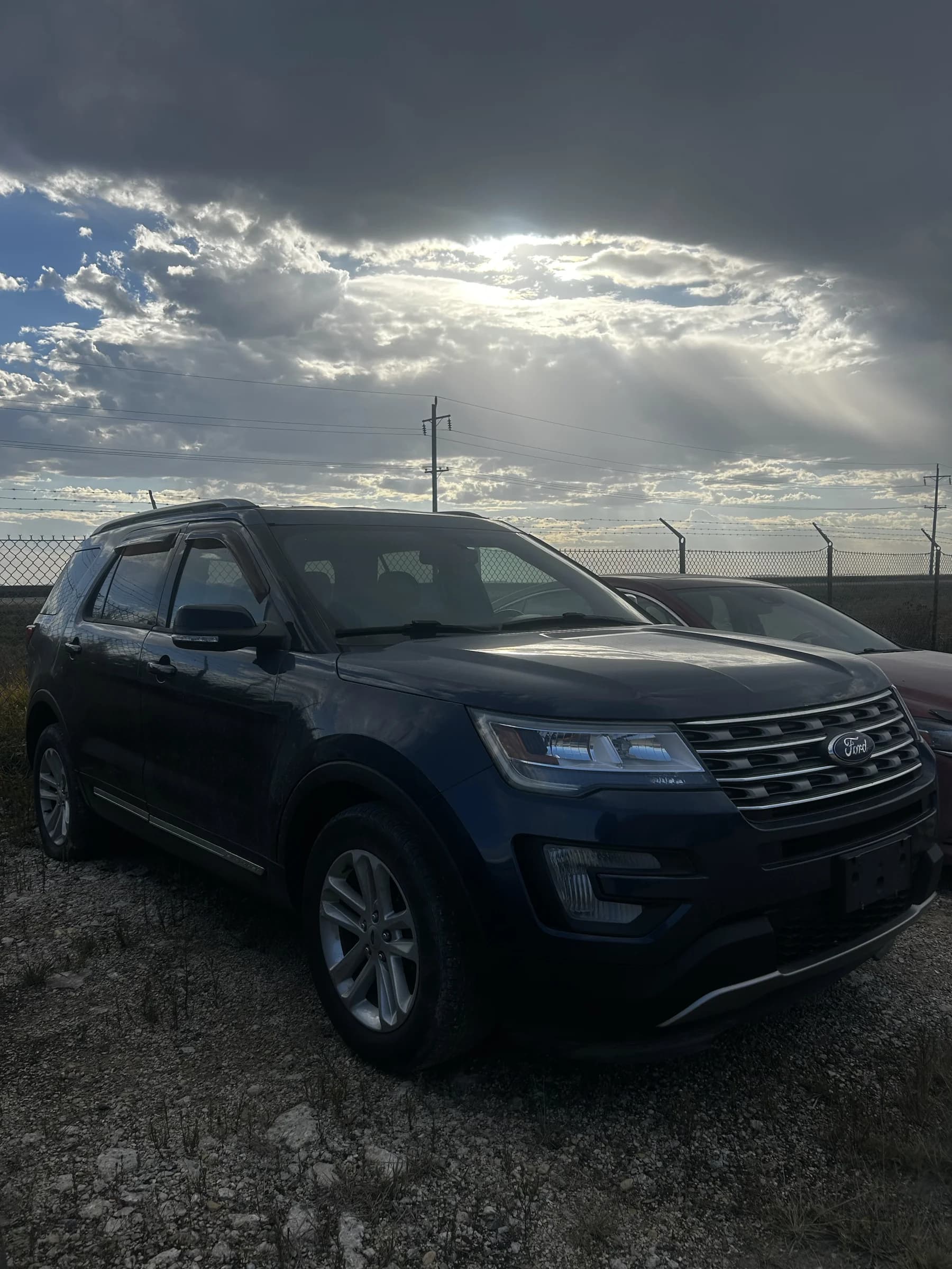 Blue 2017 Ford Explorer XLT SUV, front three-quarter view