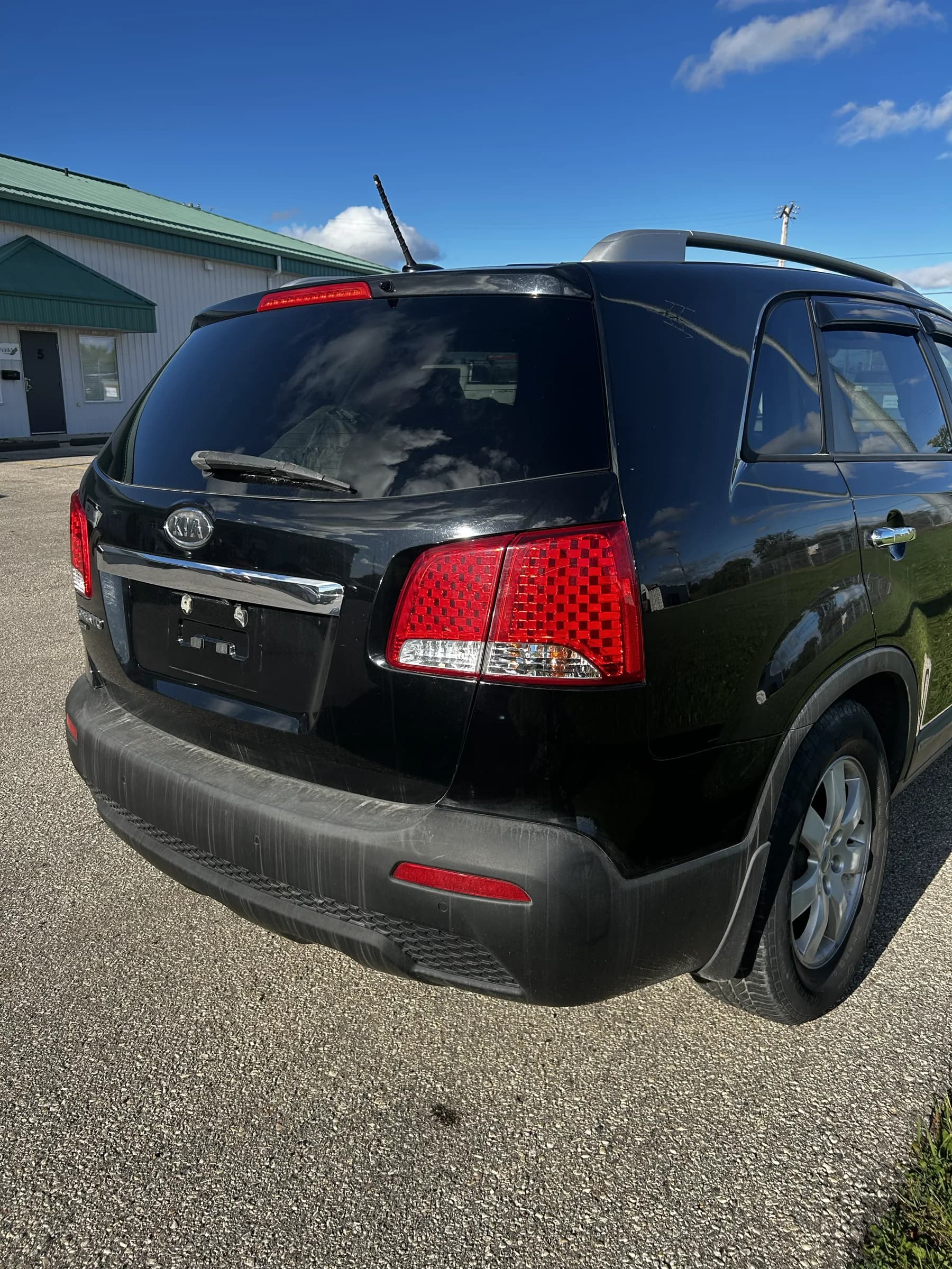 Black 2013 Kia Sorento LX AWD SUV, rear three-quarter view