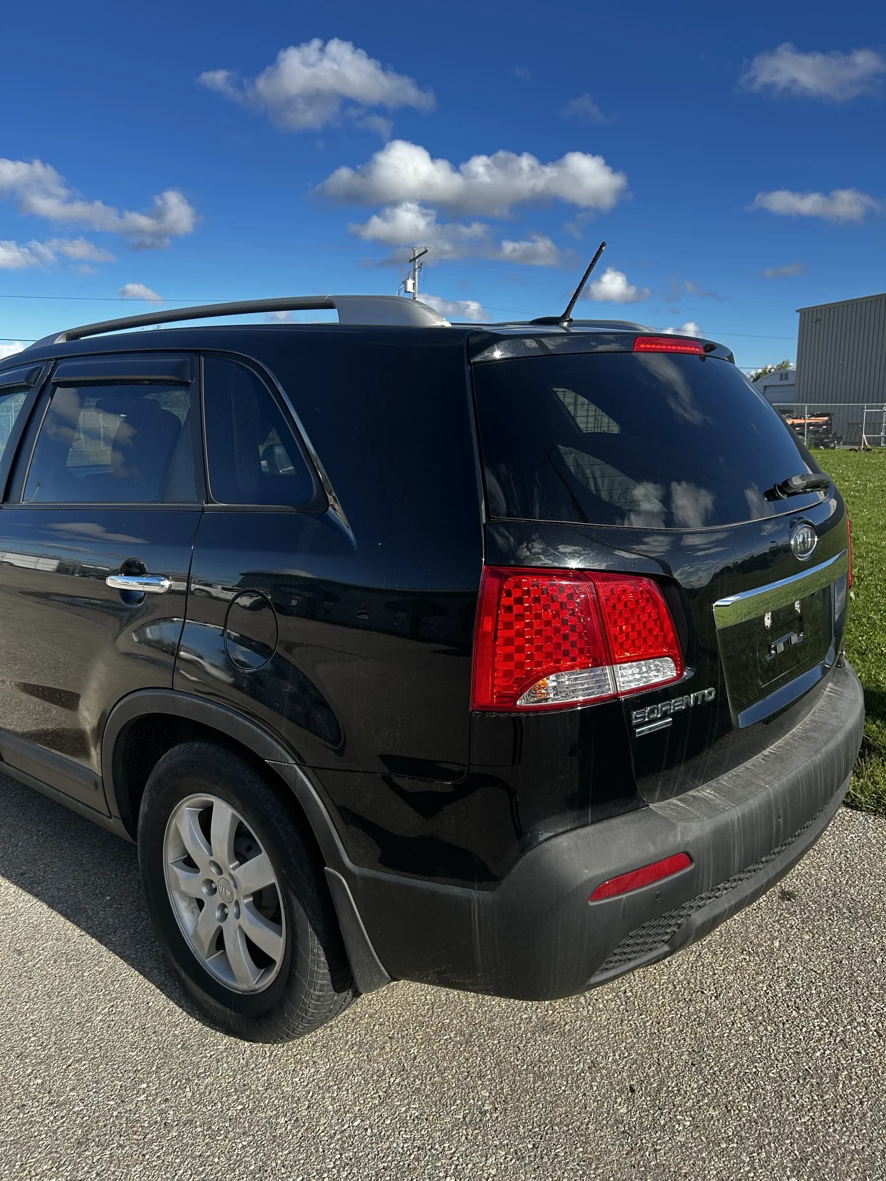 Black 2013 Kia Sorento LX AWD SUV, rear three-quarter view